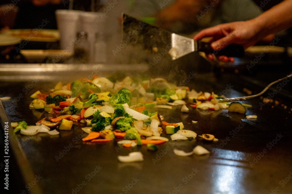Fototapeta premium Grilling vegetables at a Hibachi Steak House