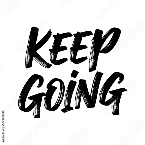 Motivational phrase keep going written.