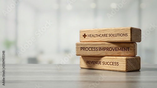 Wooden blocks with healthcare solutions process improvement revenue success on a table