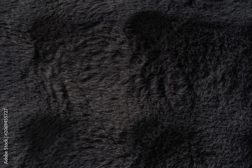 Graphite faux fur texture with rich vertical plush pattern and soft silky fibers, premium luxury background for Black Friday sale designs, fashion campaigns and upscale branding
