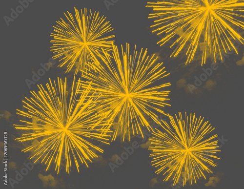 Radiant gold fireworks abstract celebration background with luxury glowing sparkles and elegant festive particle texture on black backdrop