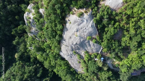 Aerial view of Sasso di Sant'Andrea, a prominent sandstone geological feature surrounded by dense forest. Zocca, Modena, Emilia-Romagna, Italy
