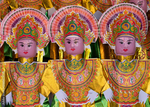 Vietnam, colourful human paper representation in a temple