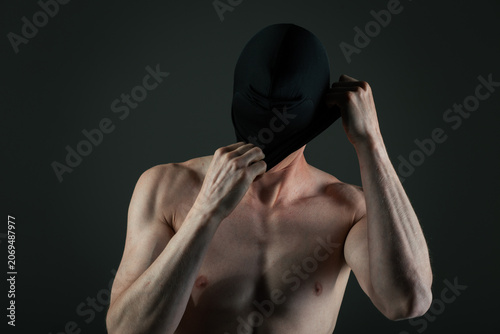 Canvastavla Athletic man in boxers and a black mask covering his face