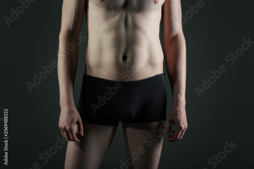 Fotografie Athletic man in boxers and a black mask covering his face