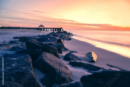 Long exposure photograph of the waterfront at Buckroe Beach in Hampton Virginia on a peaceful morning around sunrise