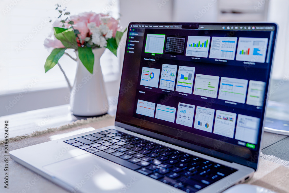 Fototapeta premium Laptop with business analytics dashboard in home office