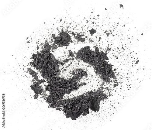 Burned and charred paper scraps isolated on a white background, top view. Pile of cinder.