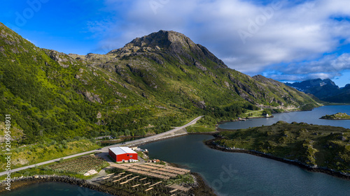 Bild auf Leinwand Red Fishing Boathouse in Lofoten Islands Norway Mountain Landscape