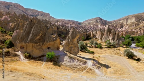 Aerial view of Zelve Open Air Museum, Cappadocia, Turkey. Winding paths, cave dwellings and rugged rock formations stretch through the historic valley.
