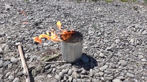 Burning napalm on the shore of a lake, made at home from soap and gasoline