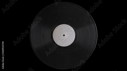 Vintage spinning vinyl record on black background