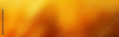 Fotografie Golden shiny metallic foil texture background with smooth reflections and gradie