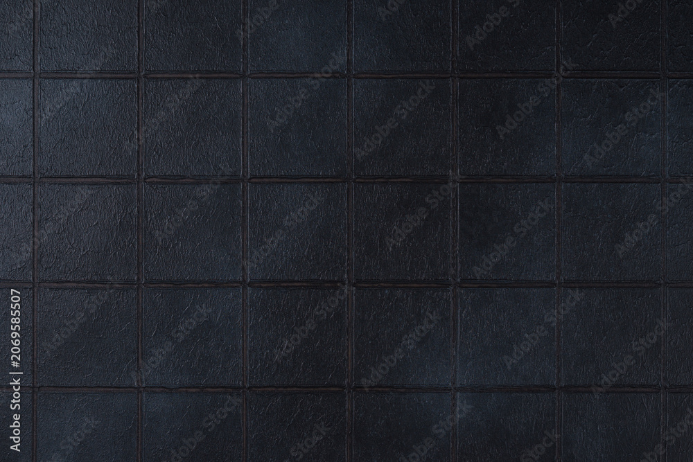 Fototapeta premium Dark black ceramic tile texture background with square pattern and subtle grunge surface. Abstract geometric wall backdrop with textured tiles and copy space. Interior element, vintage design