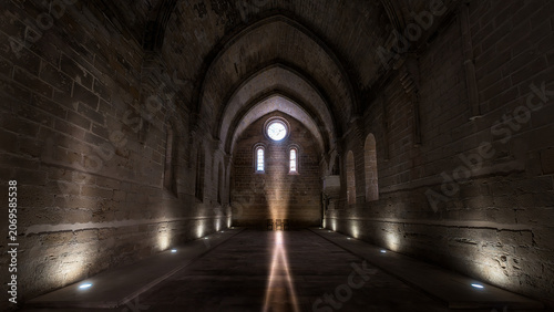 Medieval monastery stone hall with gothic arches and light beam, A majestic interior shot of a medieval stone hall inside an ancient abbey or monastery. 