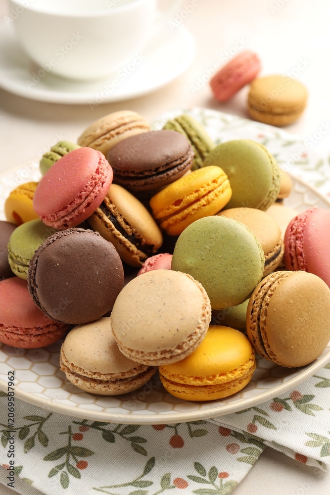 Fototapeta premium Yummy colorful macarons on table, closeup. Sweet sandwich cookies with filling