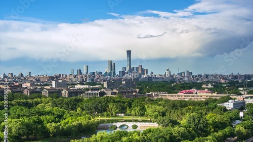 Large white clouds roll across the Beijing skyline as rain clouds dissipate, creating a daytime atmospheric cityscape time-lapse.
