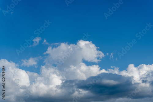 White Clouds In Clear Blue Sky Background