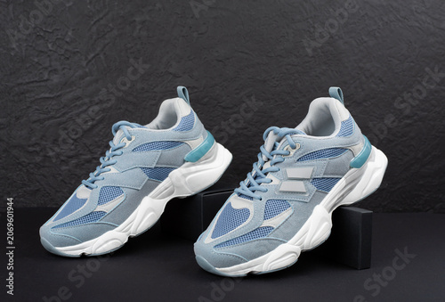 Pair of sneakers on concrete background