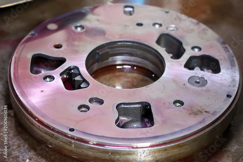 Quadro em tela Close-up view of a disassembled automatic transmission oil pump housing component showing internal gear pockets and fluid passages during a mechanical overhaul