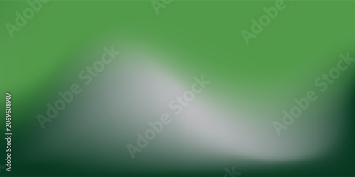 Abstract blurred gradient mesh background in green.