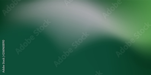Abstract blurred gradient mesh background in green.