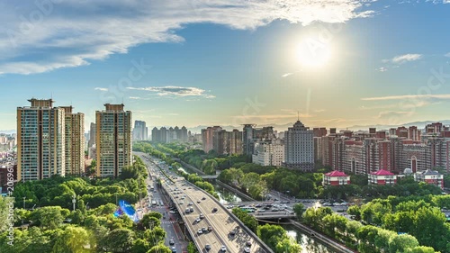 Time-lapse photography of Beijing, China: Modern urban elevated highways, traffic flow, and building complexes.
