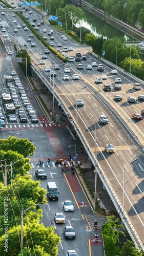 Traffic flow at the Kaiyang Bridge overpass in Beijing, China during morning and evening rush hours.