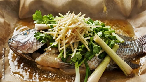 Steamed whole fish with ginger and scallions.