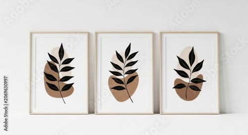 Three minimalist leaf artworks displayed together on a plain white background.