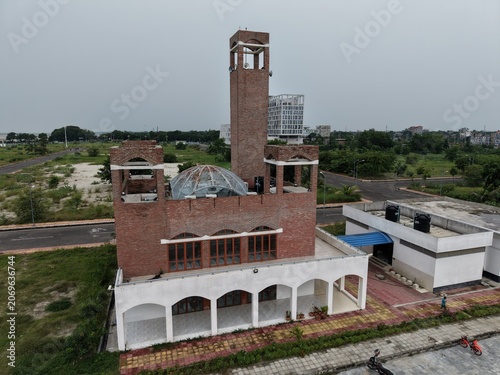 Quadro em tela Modern building with clock tower in urban area