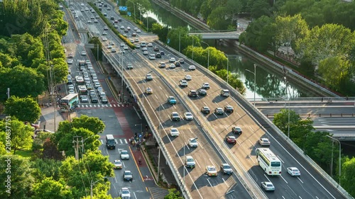 Traffic flow at the Kaiyang Bridge overpass in Beijing, China during morning and evening rush hours.