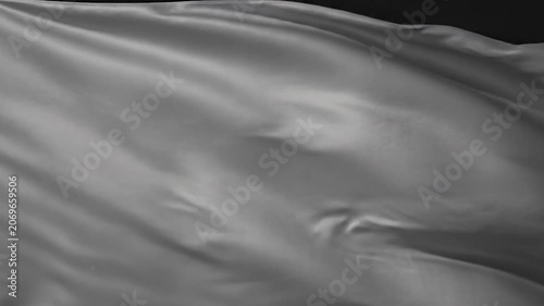 Elegant silver silk fabric flowing with soft ripples and shadows