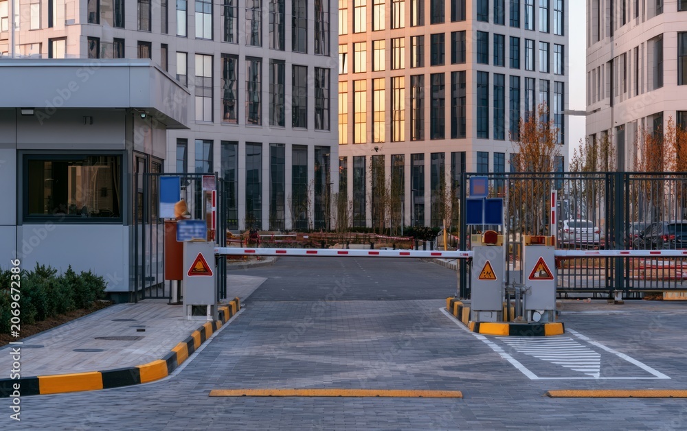 Fototapeta premium High Security Access Checkpoint at Modern Corporate Building with Barriers and Surveillance Equipment