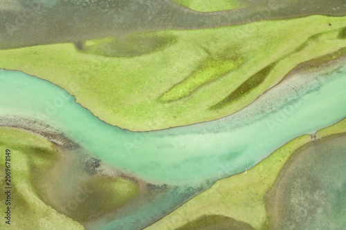 Aerial Closeup of Winding Wetland River and Green Meadow in Moon Lake, Garze