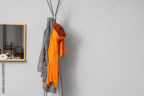 Rack with coat, warm beret ...