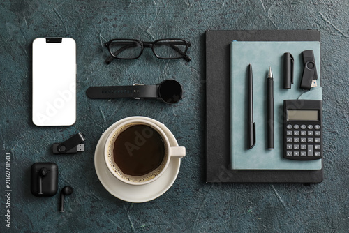 Cup of coffee with mobile p...