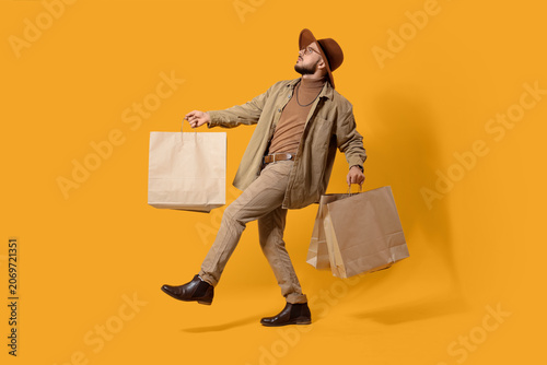 Stylish young man with shop...