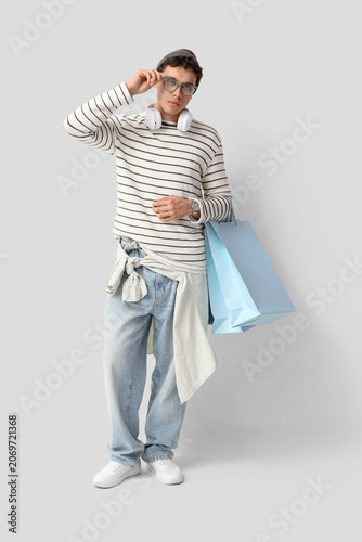 Stylish young man with shop...