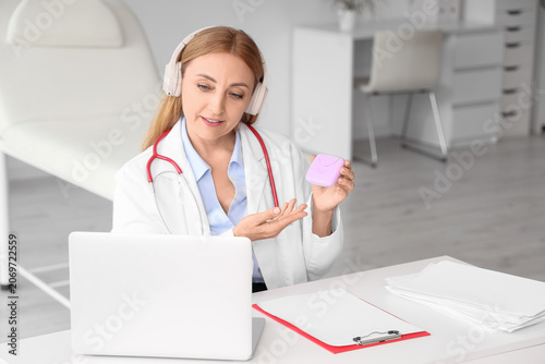 Female gynecologist with ta...