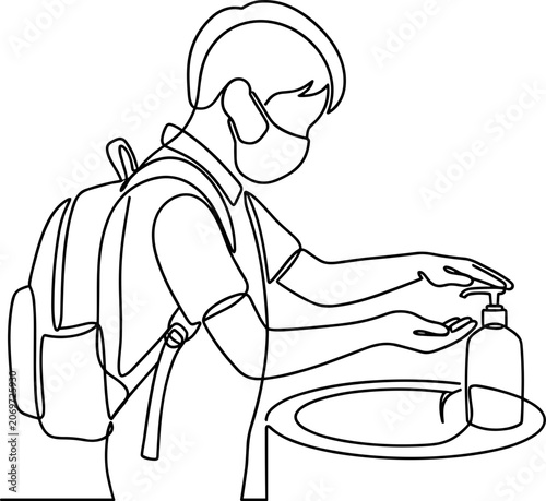 Fotografie Continuous line drawing of a schoolboy using hand sanitizer.