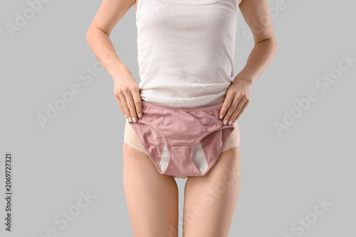Young woman with menstrual ...