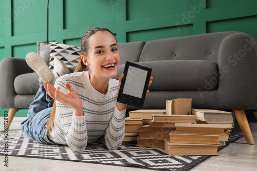Young girl with e-reader an...