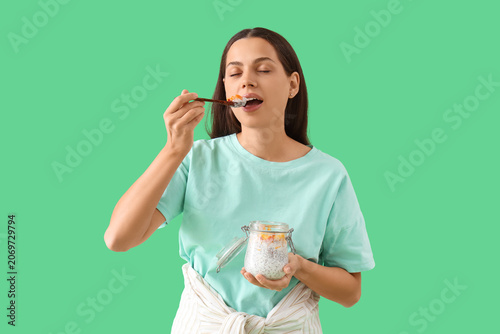 Young woman eating chia see...