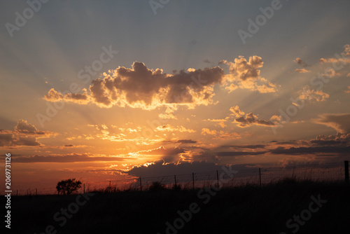 a sunset in sky above the country