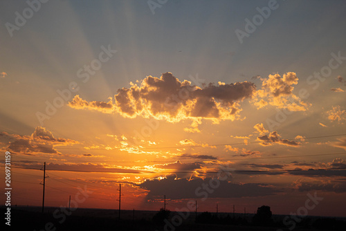 a sunset over the country sky