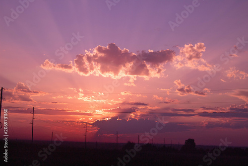 a pink sunset in the sky 
