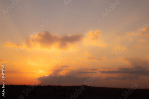 a moody orange sunset in the sky