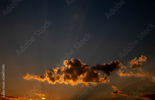 fire in the sky - joyful rays coming from the clouds