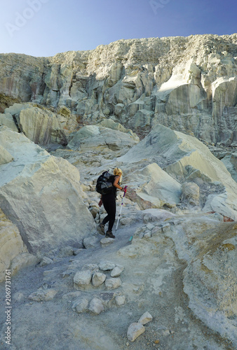 Female Hiker Exploring Ijen Crater Landscape in Banyuwangi, East Java, Indonesia.
